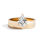 gold band with kite offset diamond on white background