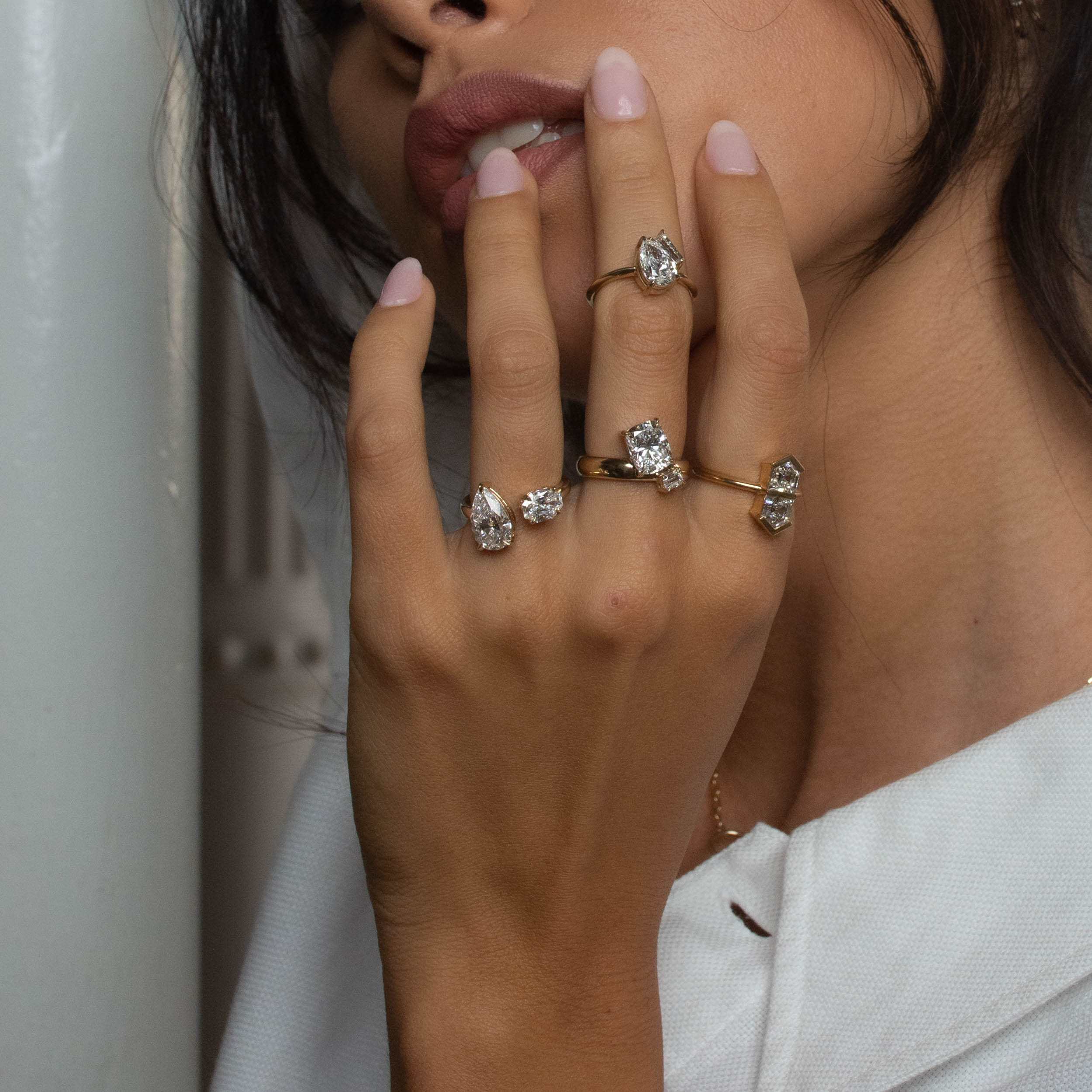 Rings in 14k yellow gold and diamonds by Shahla Karimi on model