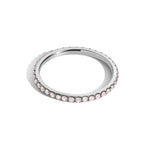 pink diamond eternity band on white gold on white background