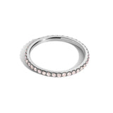pink diamond eternity band on white gold on white background