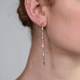 Chrysler Drop earrings by Shahla Karimi on person's ear
