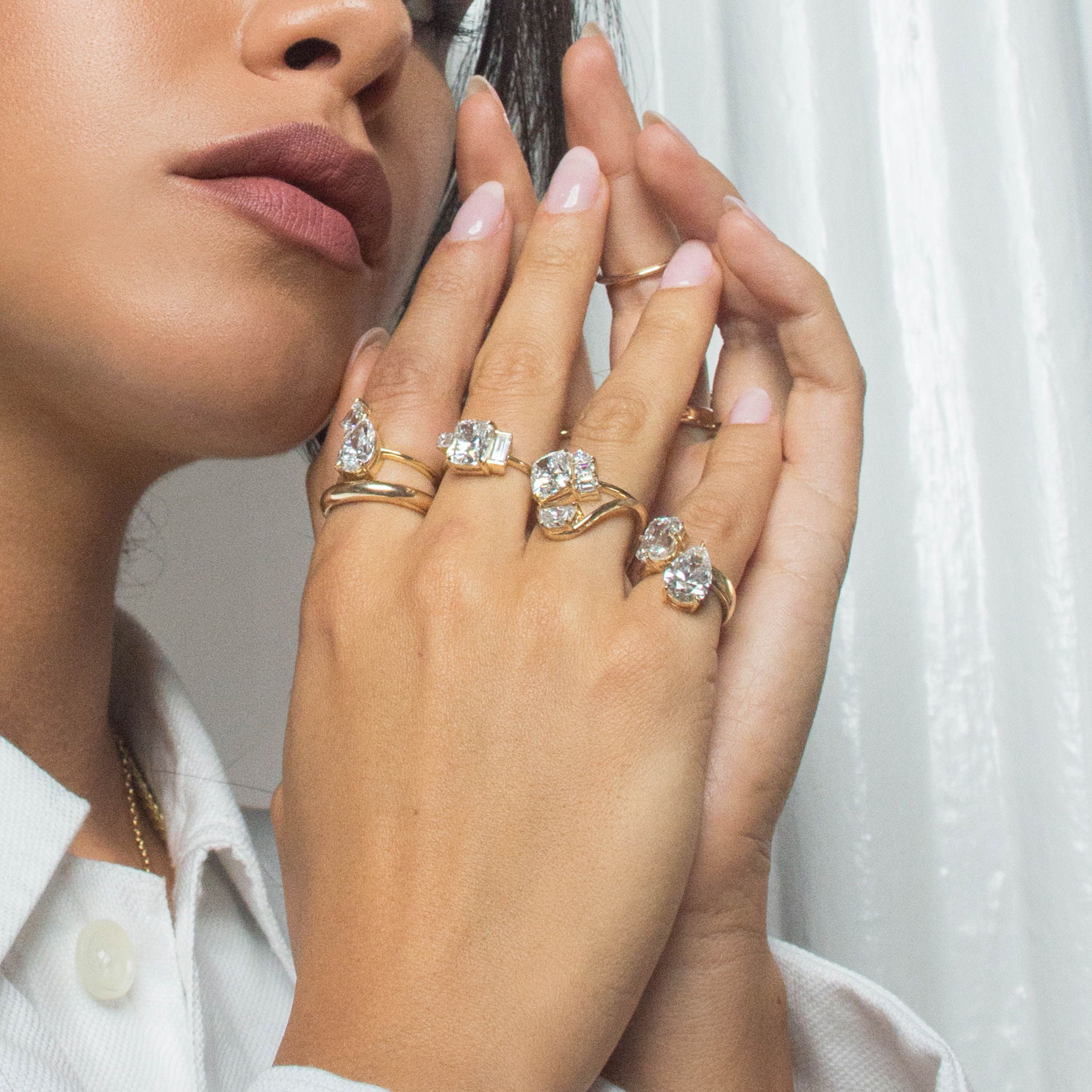 Soho engagement ring collection stacked on hand